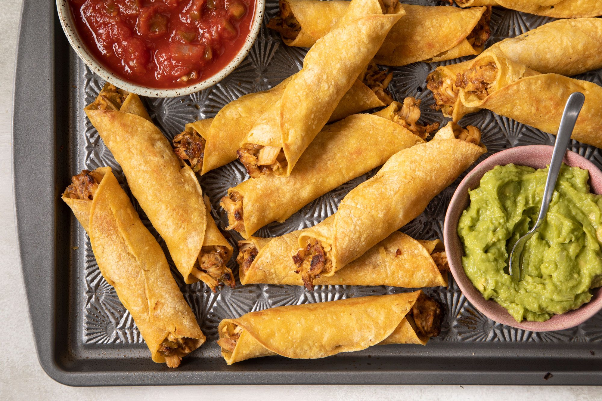 Chicken Taquitos served with sauces