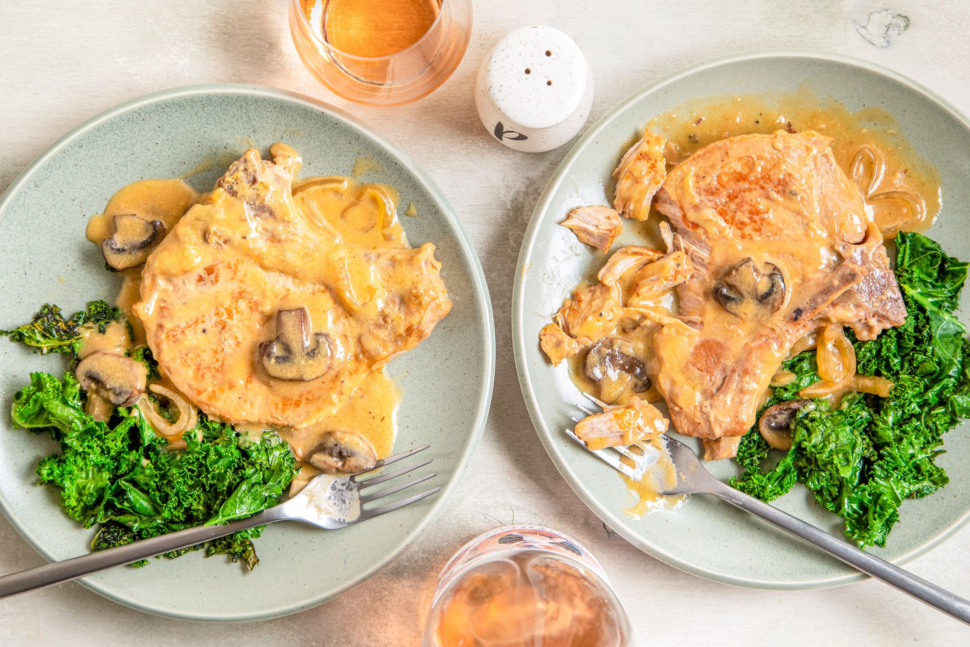 Crockpot Smothered Pork Chops Served in Two Plates with Two Forks