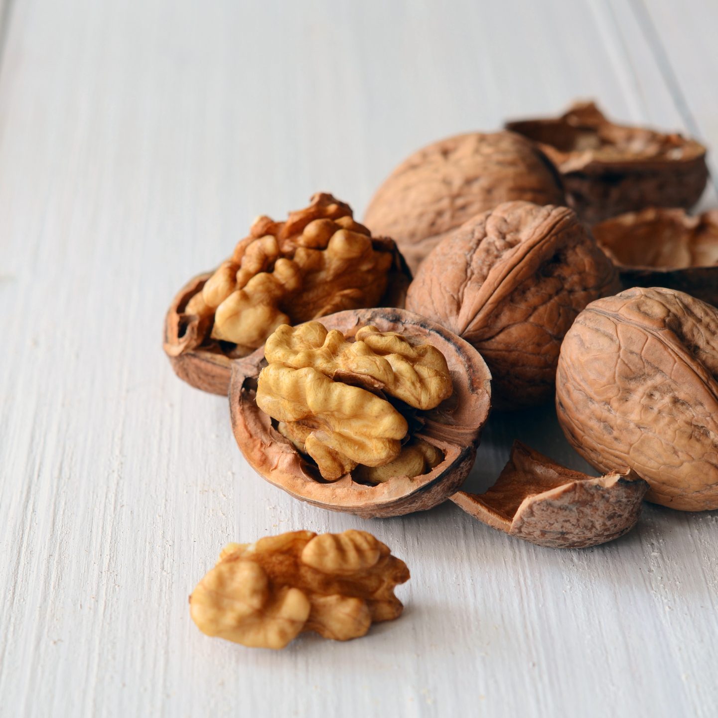 Walnuts on rustic old wooden table
