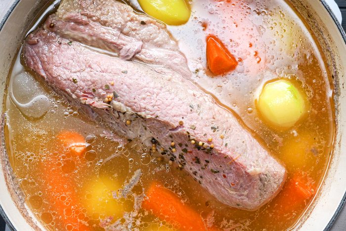 cooking corned beef with potatoes and carrots