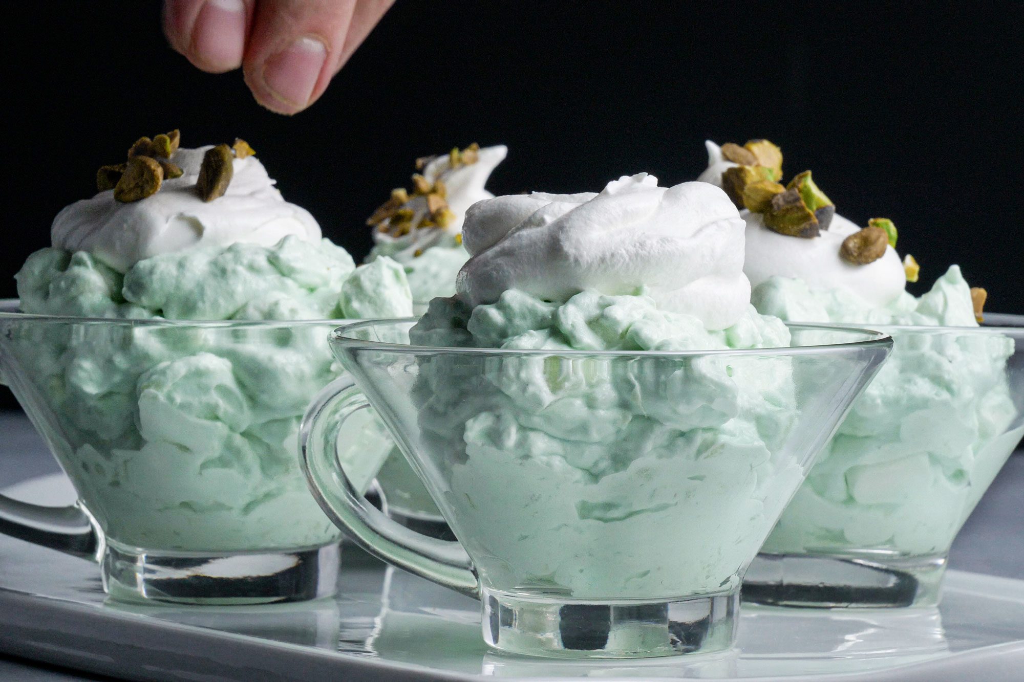 Pistachio Mallow Salad served into a few small glass bowls