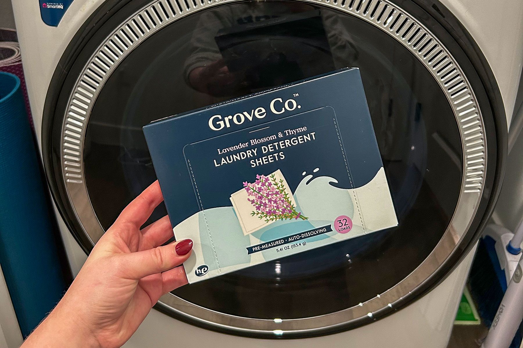 Holding box in front of a washing machine