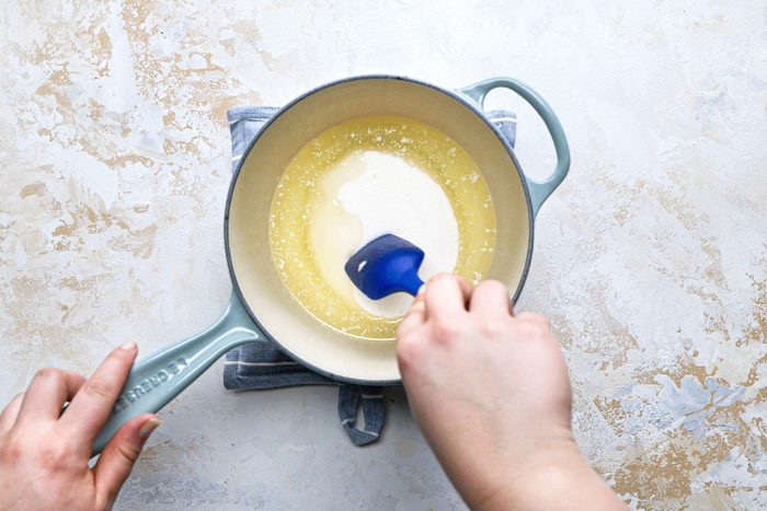 Sugar and milf mixed Large saucepan with a spatula