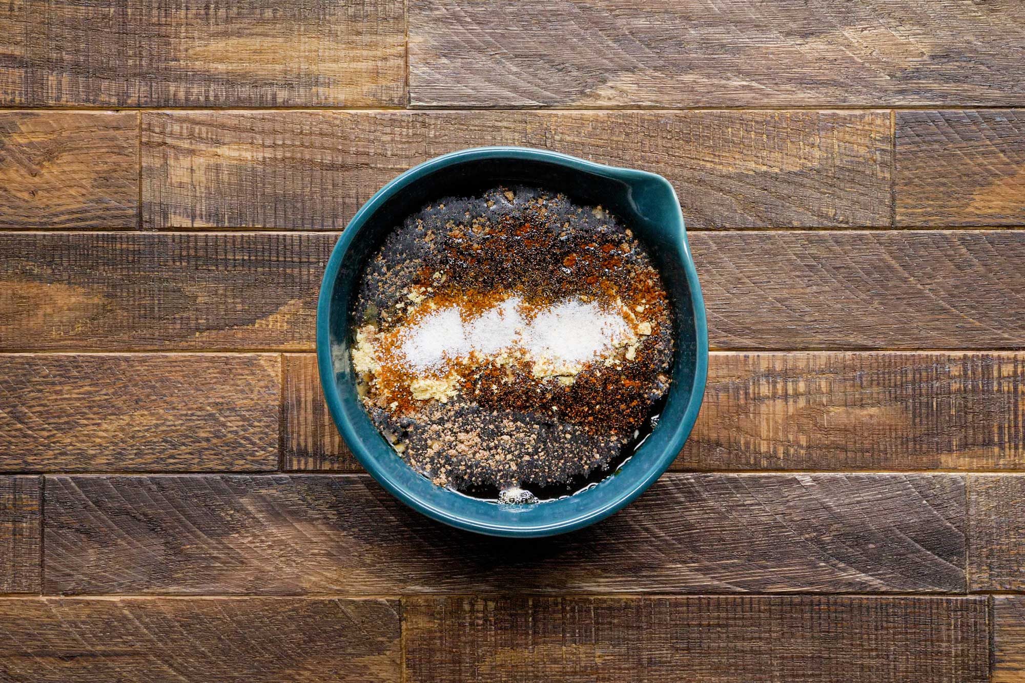 Combine the water, Worcestershire sauce, vinegar, garlic, bouillon, chili powder, mustard, cayenne and garlic salt in a small bowl