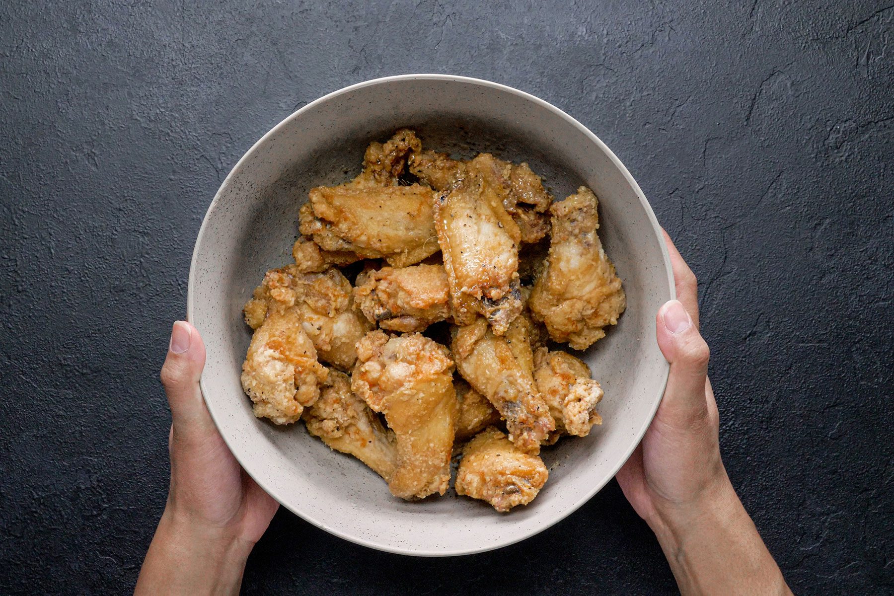 Drying Lemon Pepper Wings in large bowl