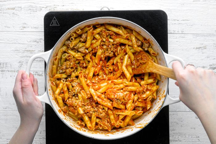 Spoon the half pasta mixture and top it of with the cheese mixture