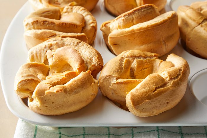 A muffin tray with baked Popovers