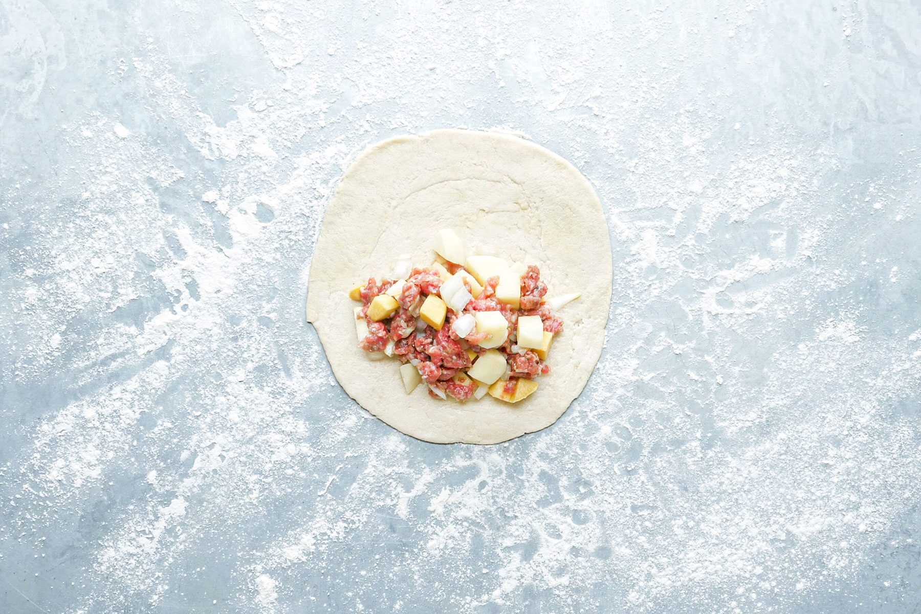 Adding filling in dough