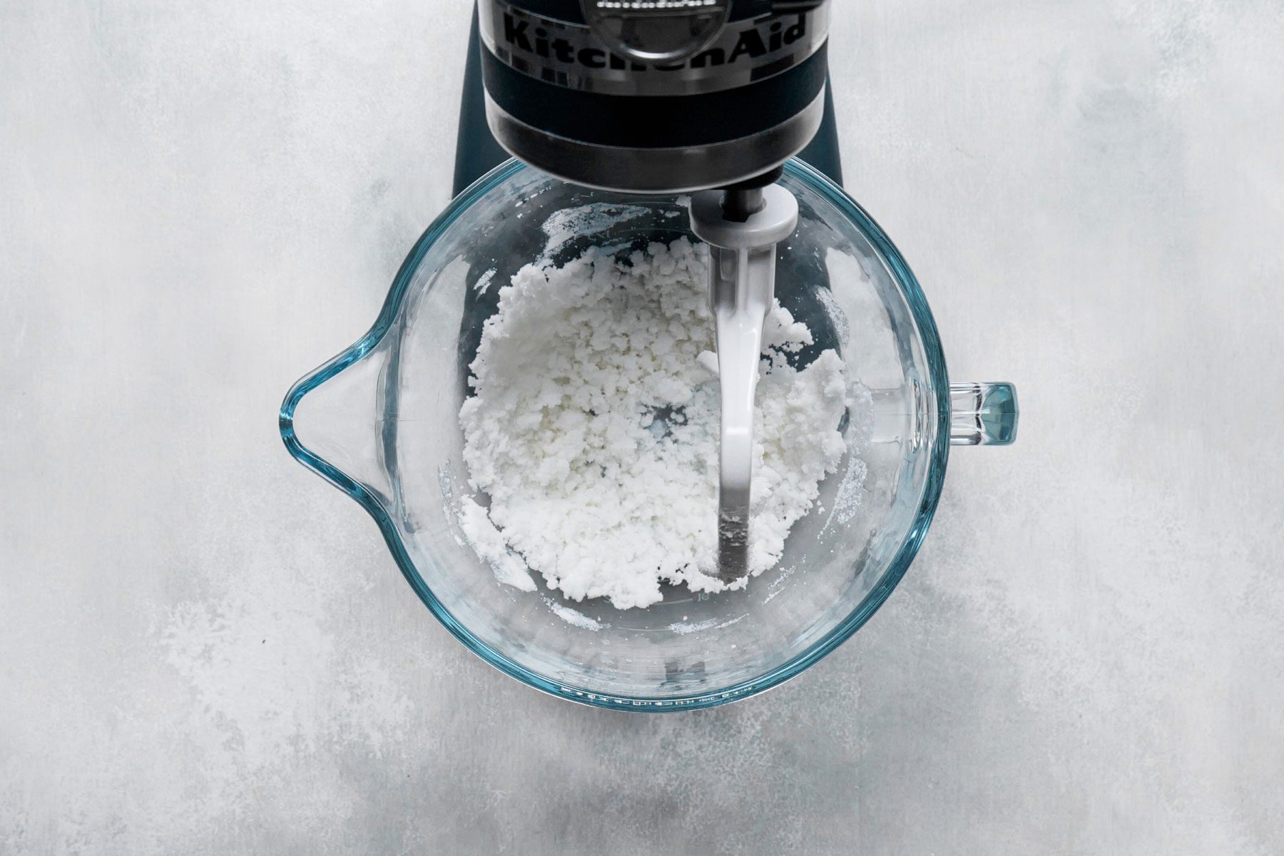 Shortening and sugar blended together in a large bowl with a stand mixer