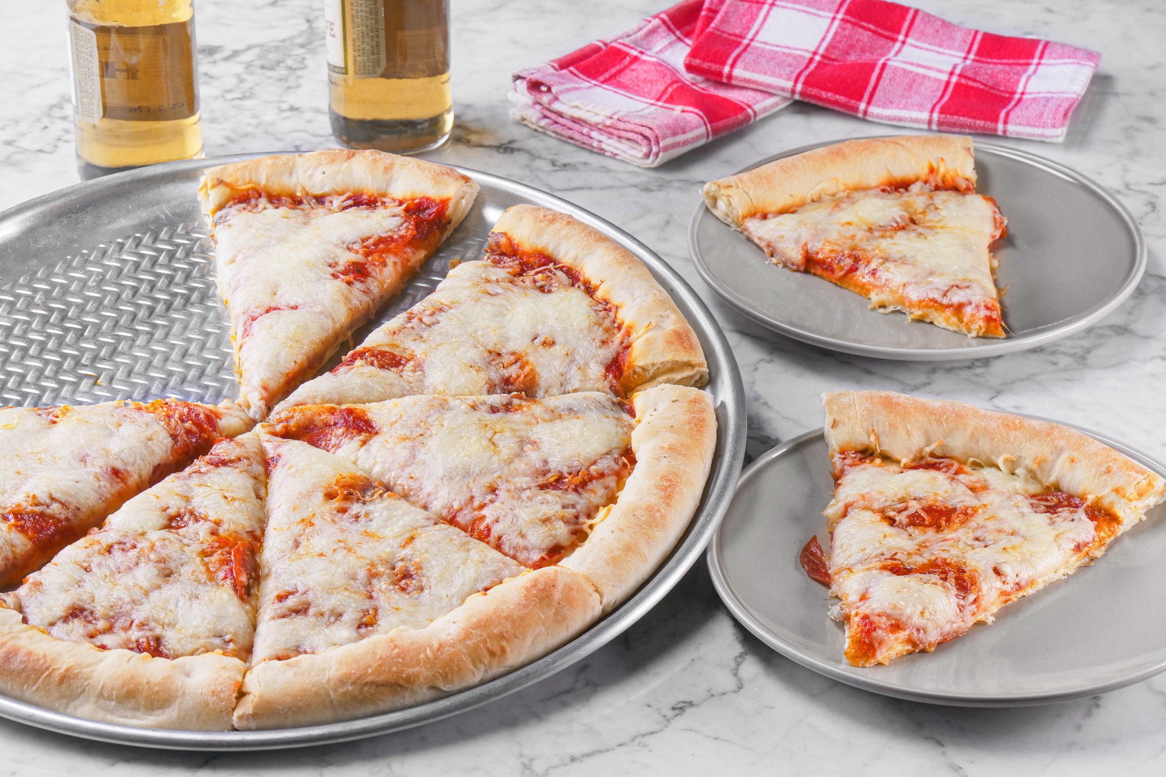 Pepperoni pizza with two slices on a plate