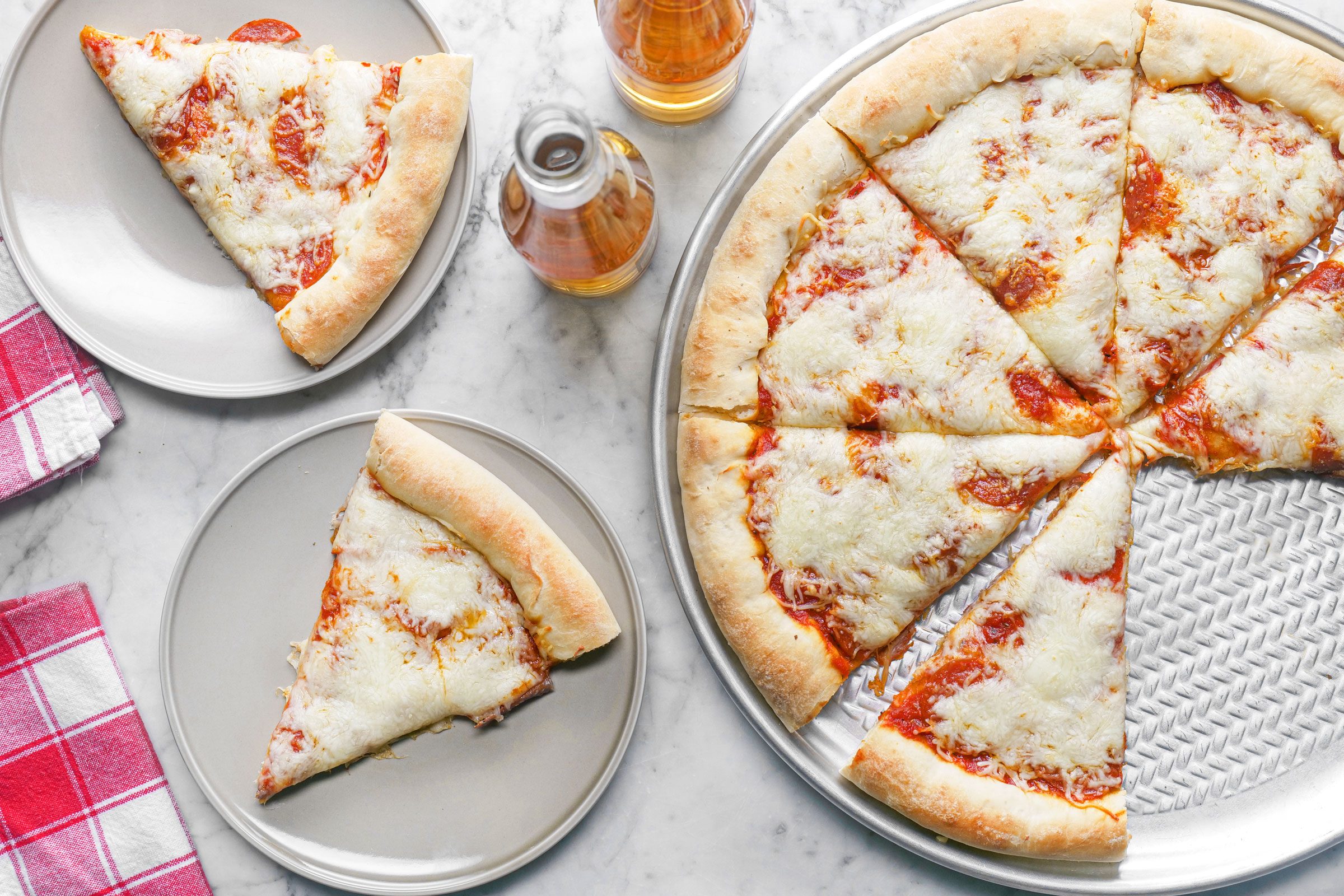 Pepperoni pizza with two slices on a plate