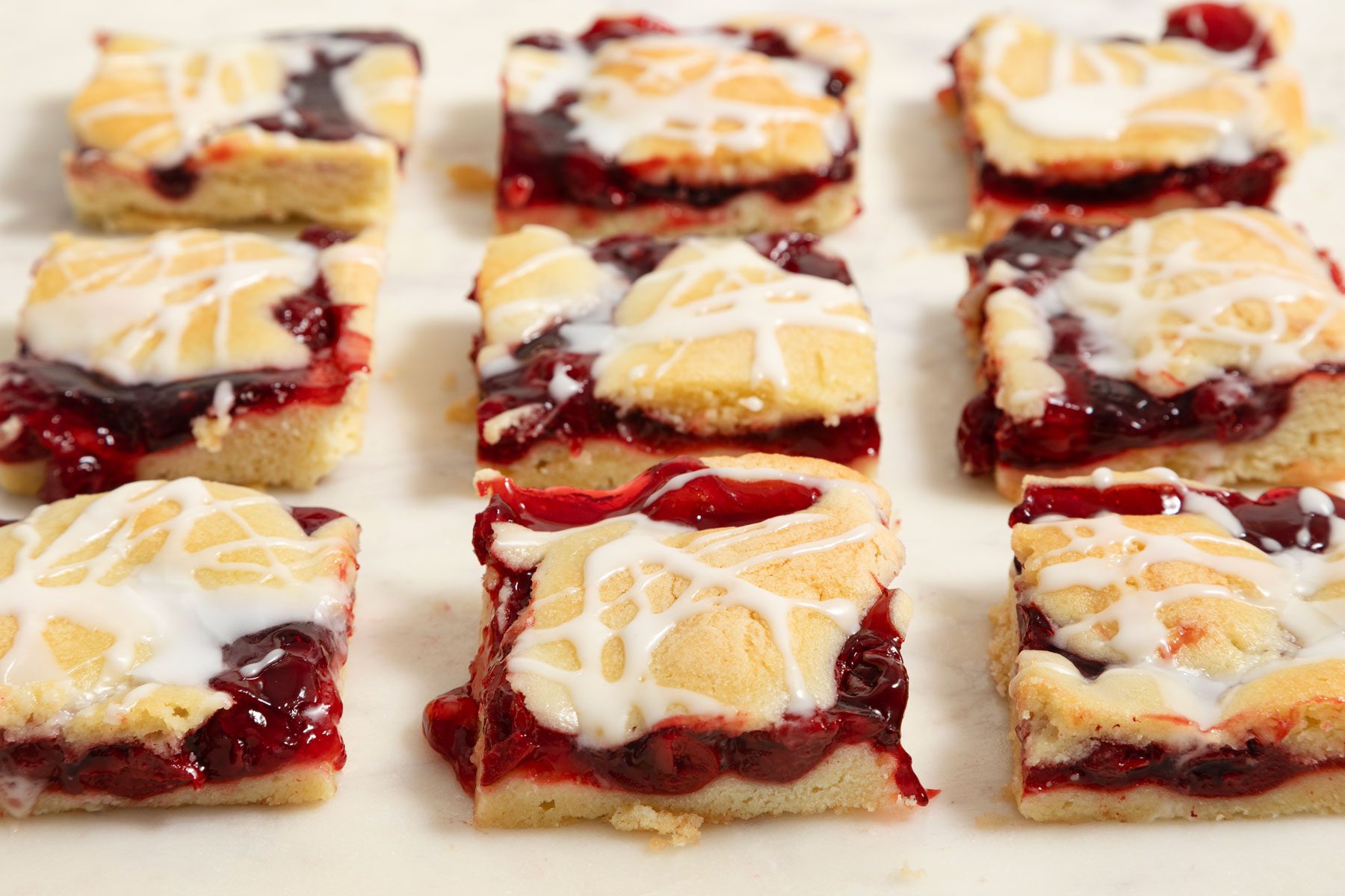 Cherry Pie Bars arranged on a table