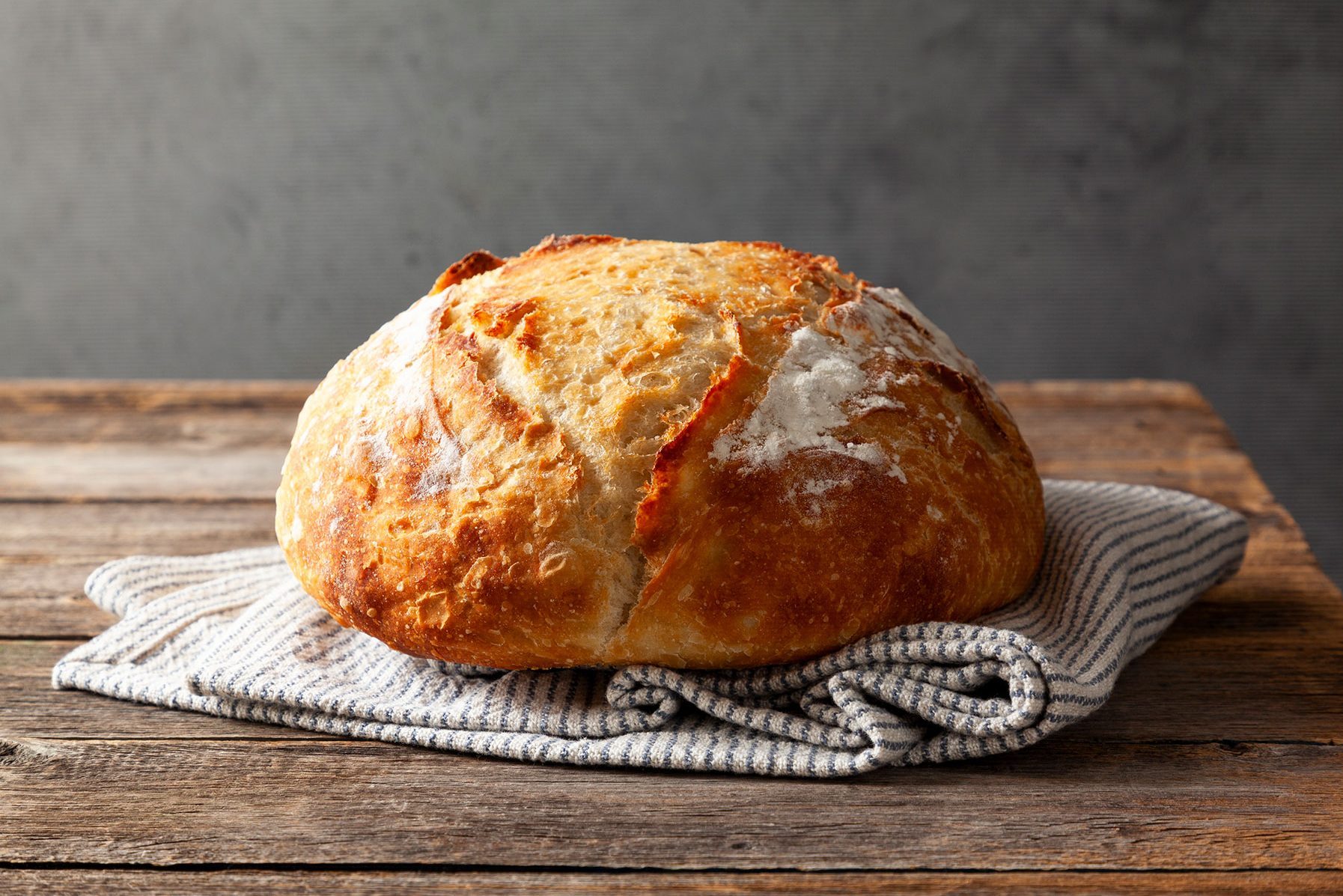 Crusty Homemade Bread on wooden base