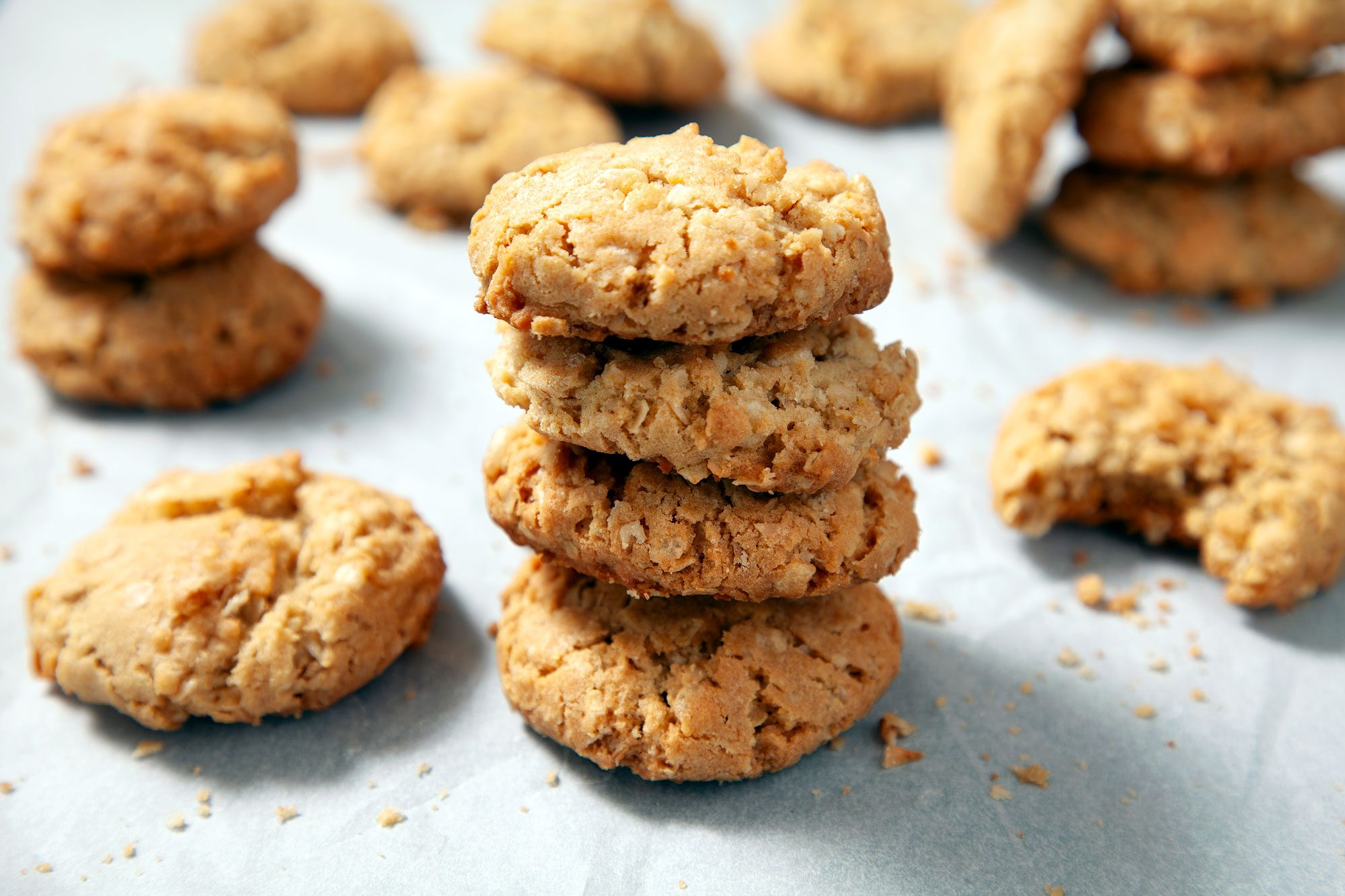a stack of Ranger Cookies Placed on a parchment paper sheet