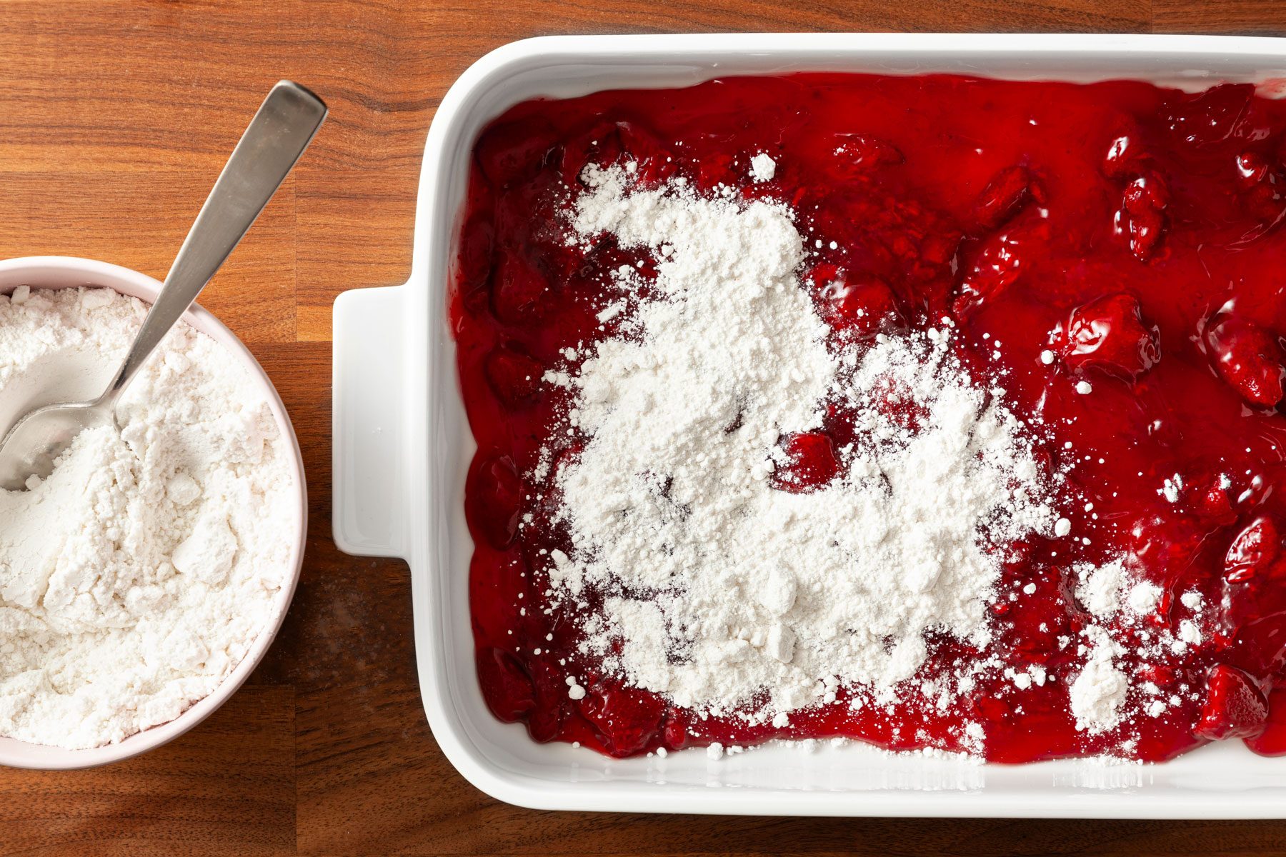 Cake mix sprinkled over Strawberry pie filling