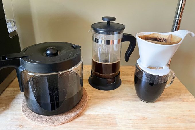 Black coffee inside coffee maker on a table