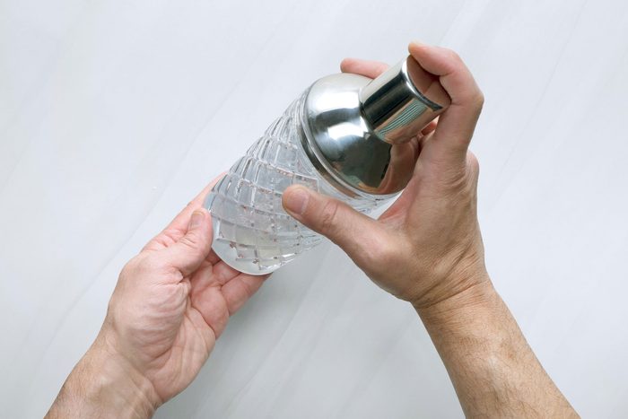 Mixing ingredients into shaker