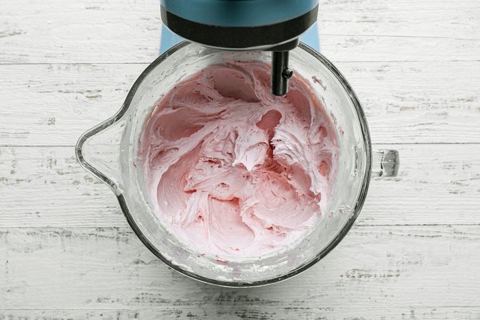 Making Strawberry cream cheese frosting