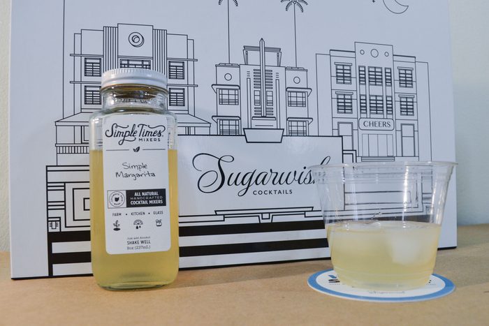 Sugarwish Cocktail Mixer with a glass and a jar on a table