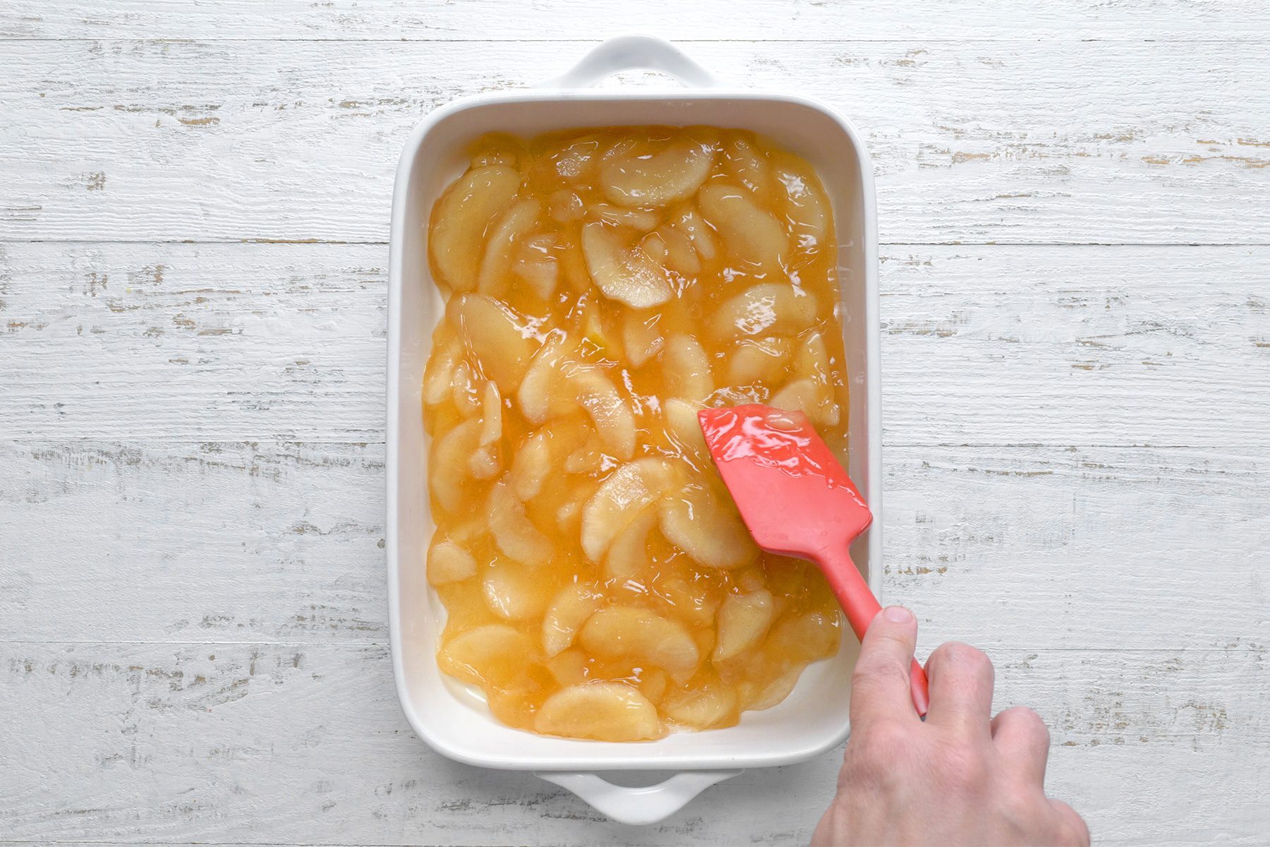 overhead shot of apple pie filling in the baking dish