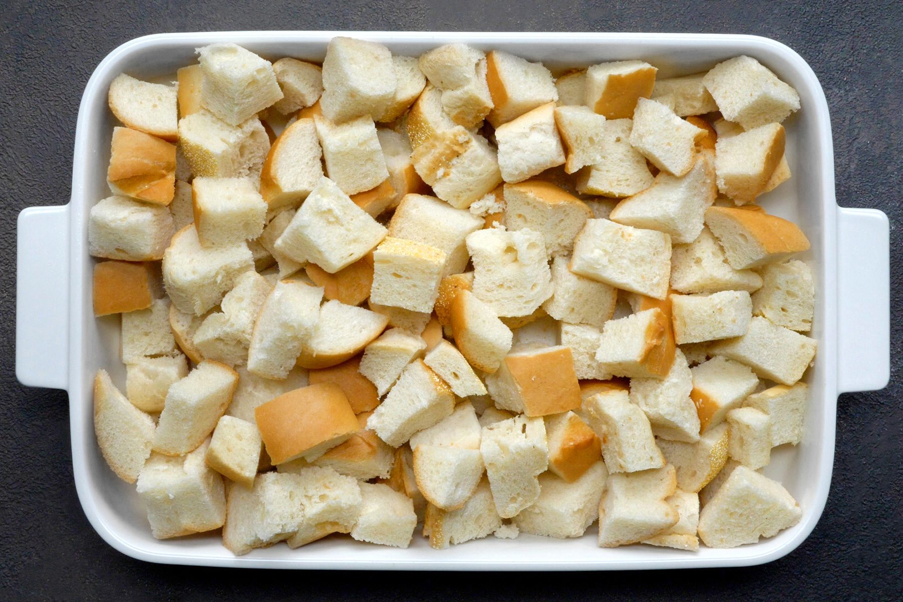 A baking dish of French bread cubes
