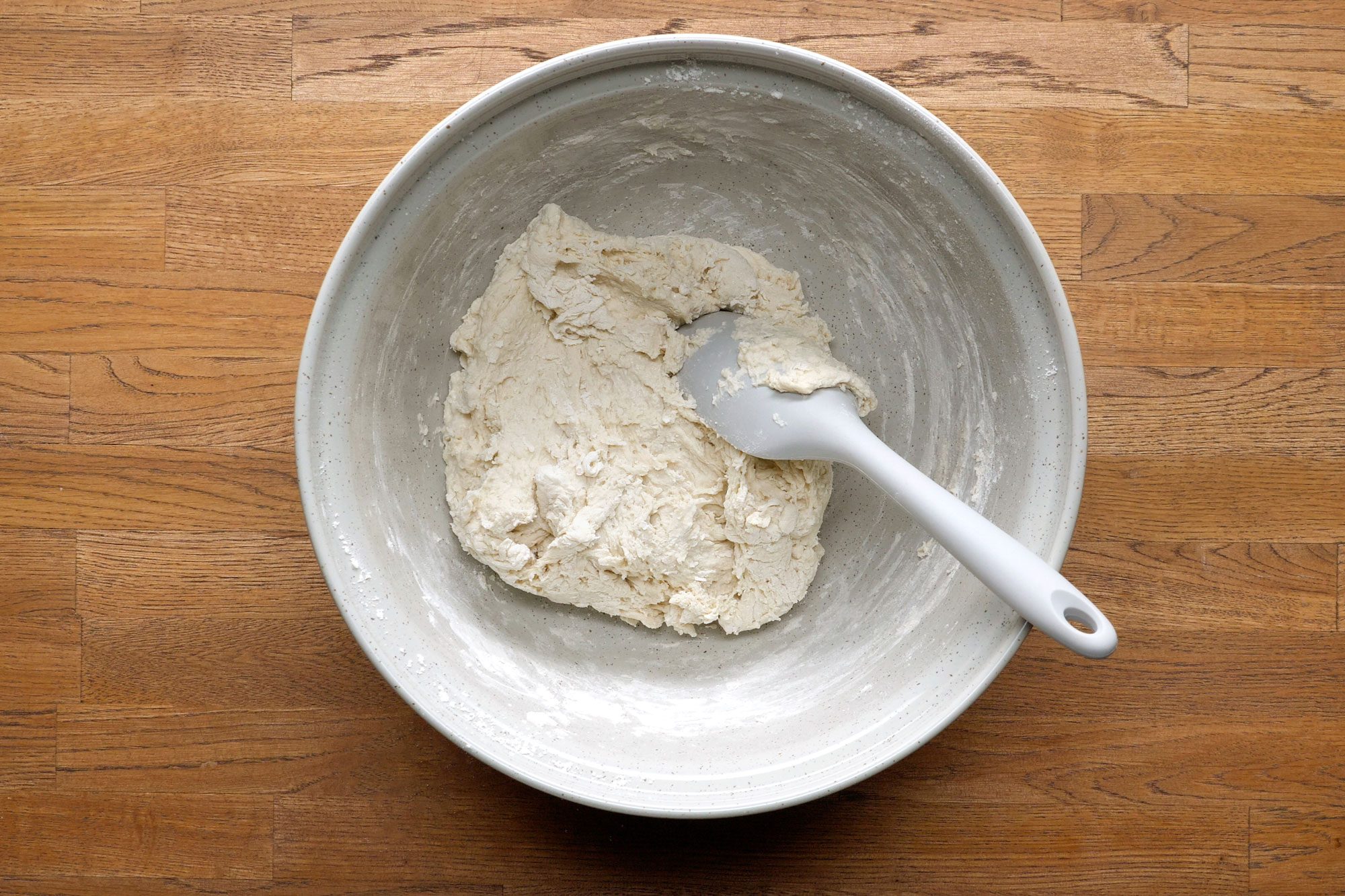 Ingredients mixed in a large bowl to form a dough