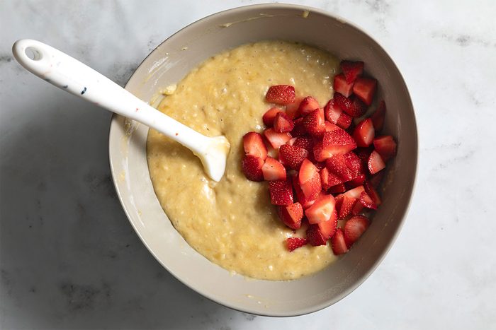 overhead shot of chopped strawberries mixed in flour mixture