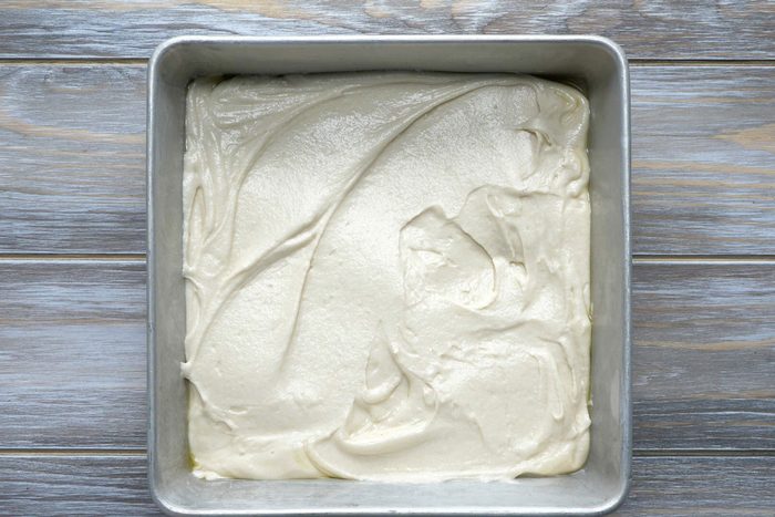 Pour the batter into the pan and spread it evenly to all four corners