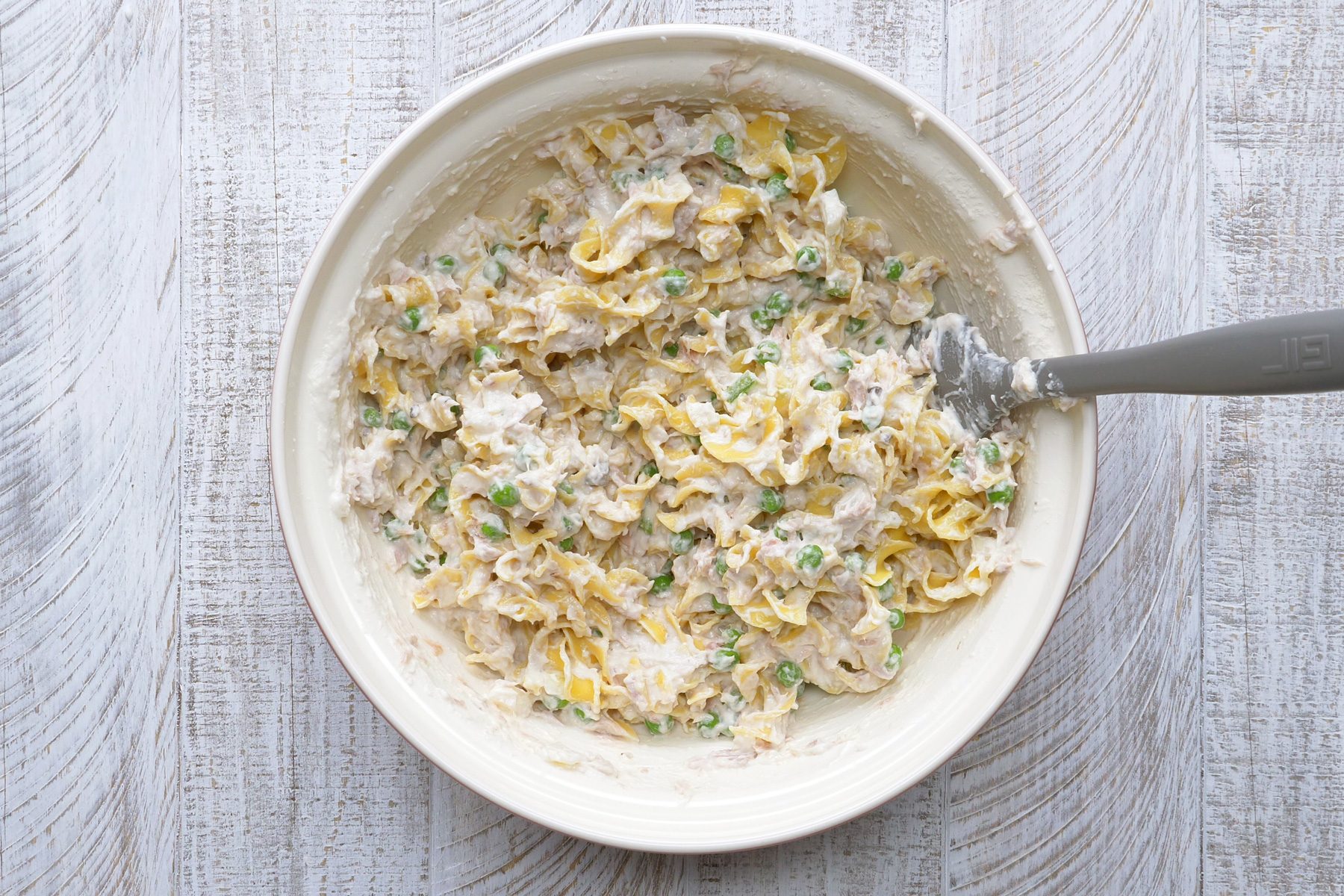 A bowl of bread crumbs with melted butter.