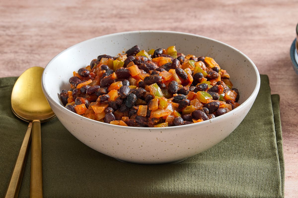 Angled shot of Cuban black beans served in a bowl