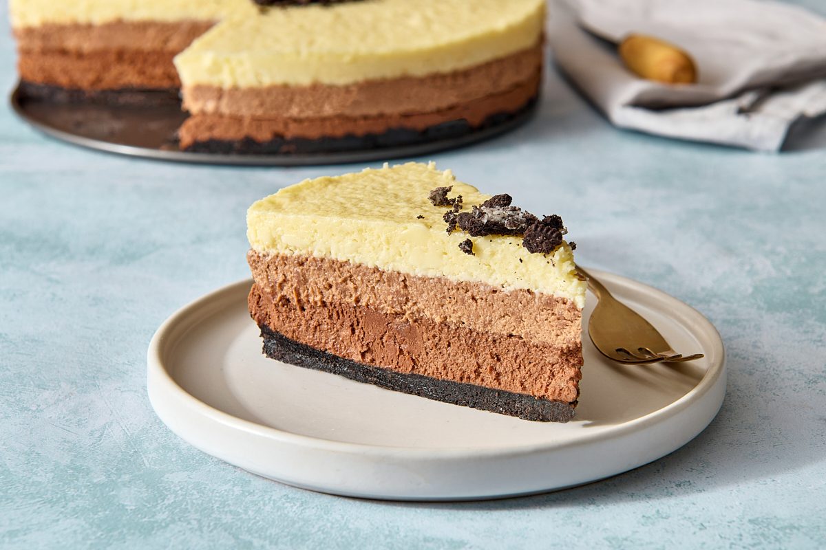 Closeup of a single piece of triple chocolate mousse cake