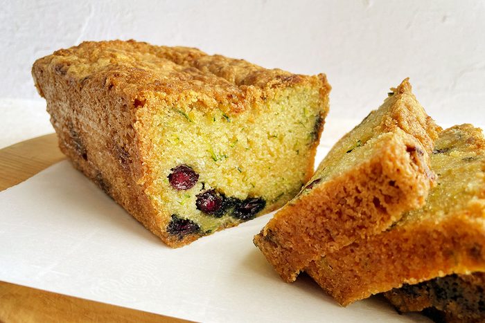 Close up of Taste of Home's Blueberry Zucchini Bread sliced on a cutting board