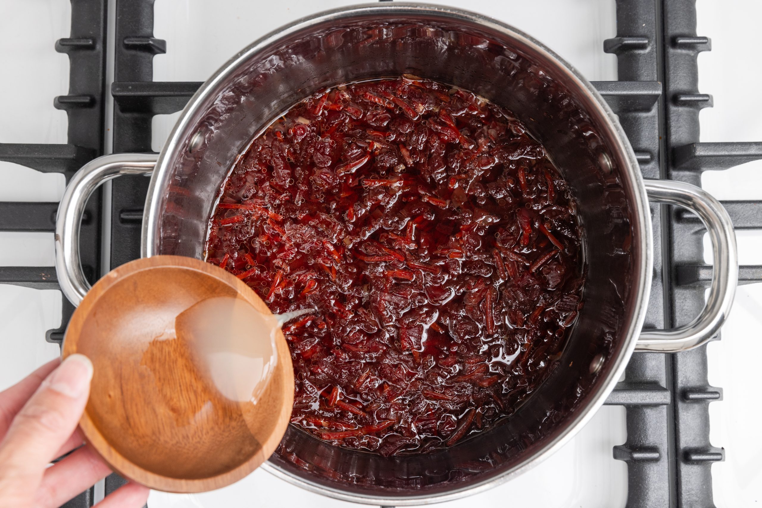 Finishing soup with lemon juice stirred in before serving.