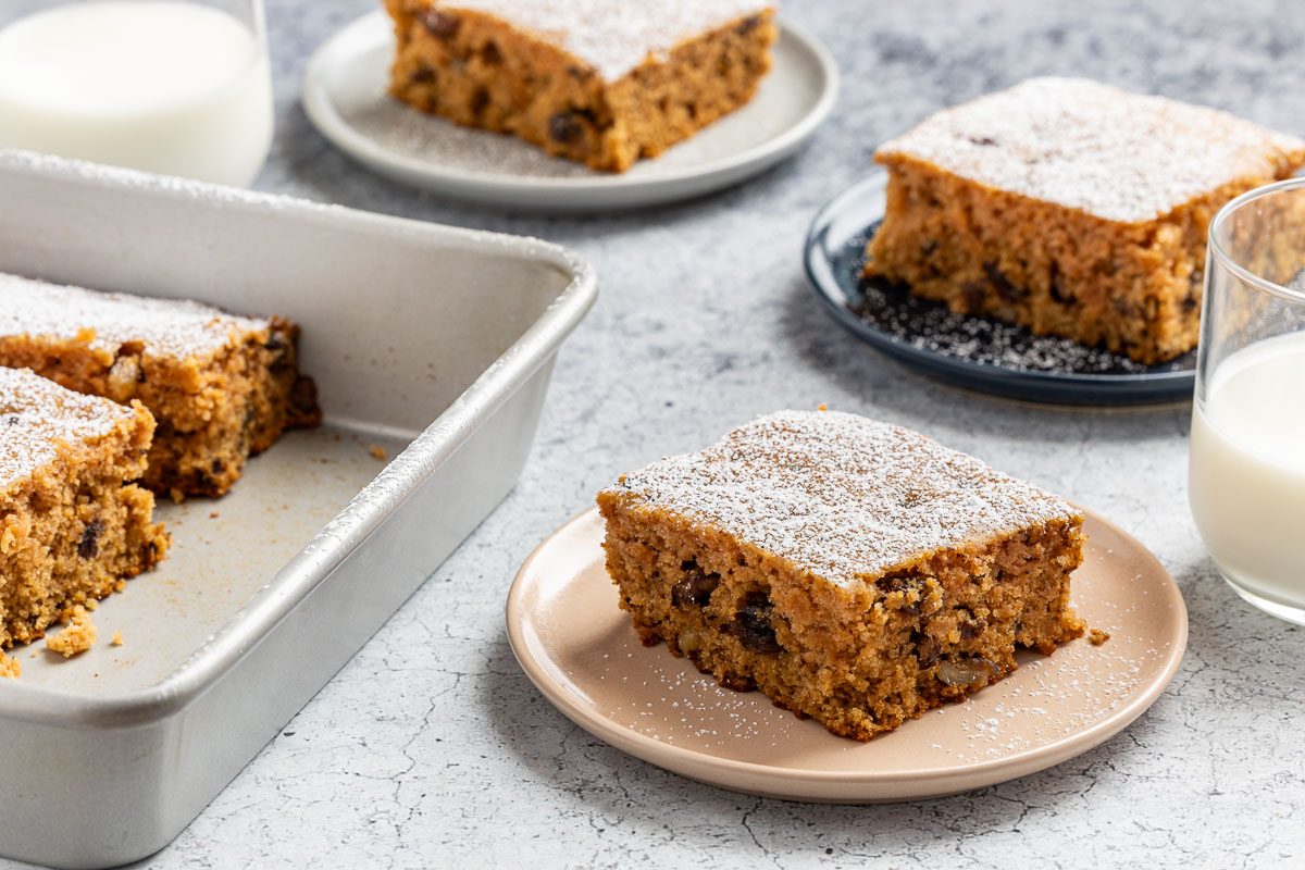 Taste of Home Applesauce Cake photo of the finished recipe cut into slices and placed on plates.