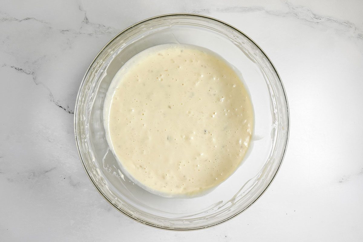 Batter for Taste of Home Banana Coffee Cake in a glass bowl on a marble surface
