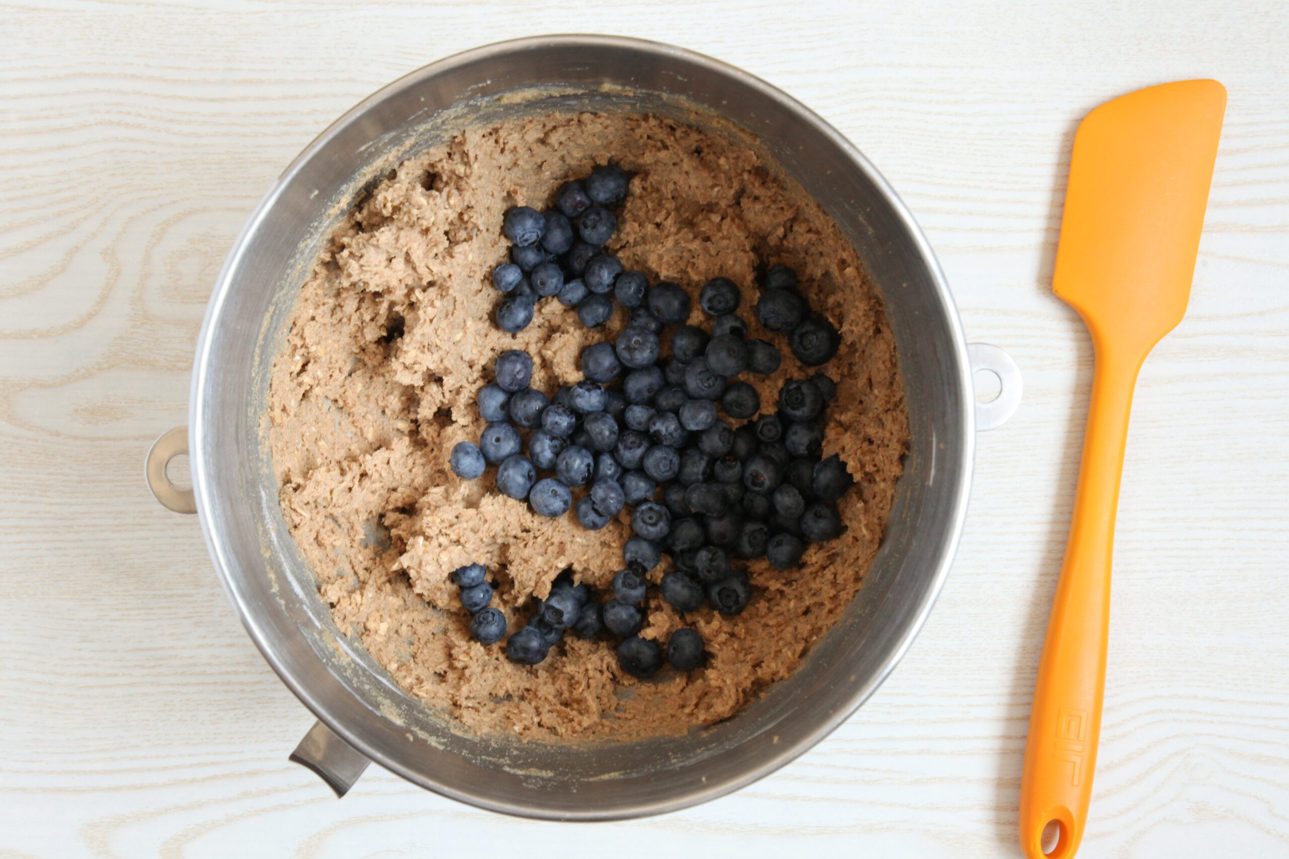 Adding blueberries to oatmeal cookie dough