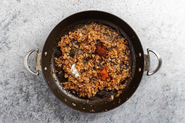 Taste of Home Bourbon Bacon Jam recipe photo of the carmeilzded onions with seasonings.