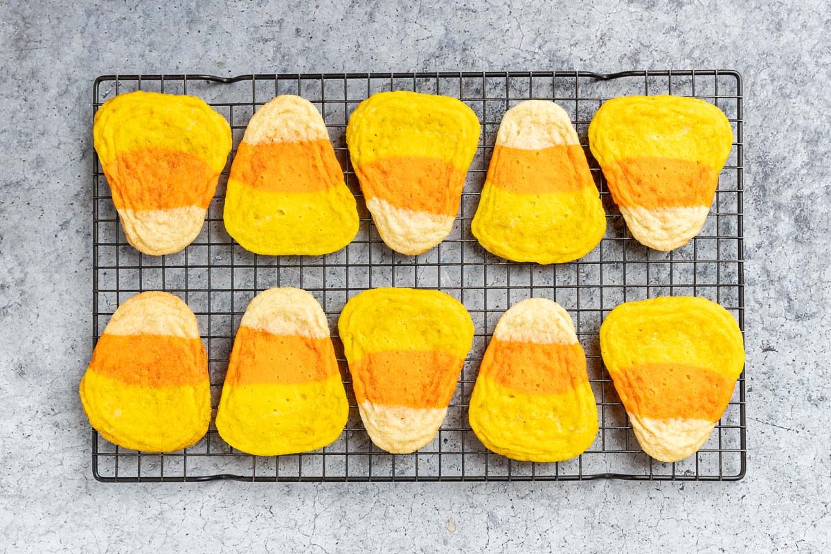 Taste of Home Candy Corn Cookies recipe photo of the baked cookies on a cooling rack.