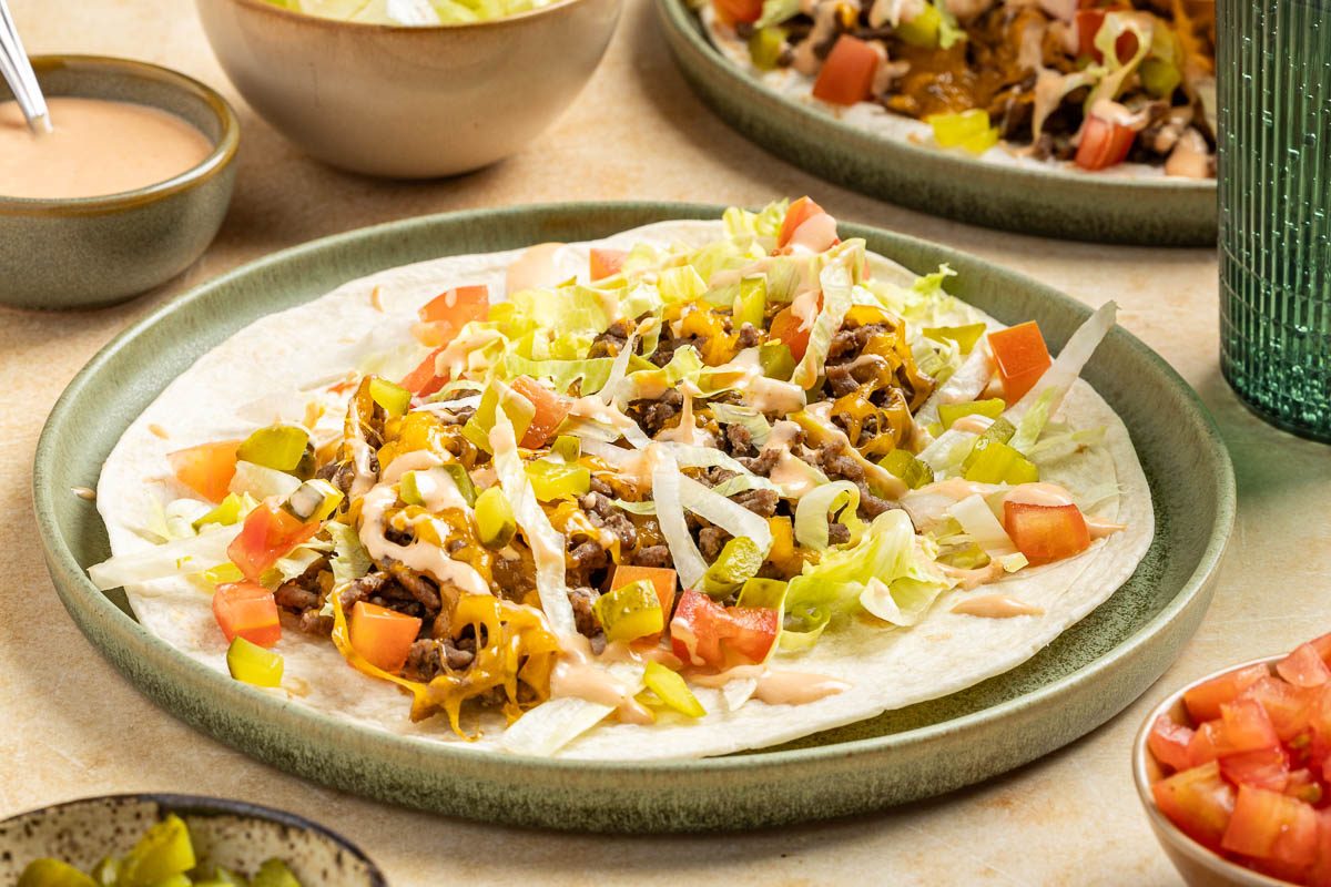 Taste of Home Cheeseburger Tacos recipe photo of the finished recipe served on plates.