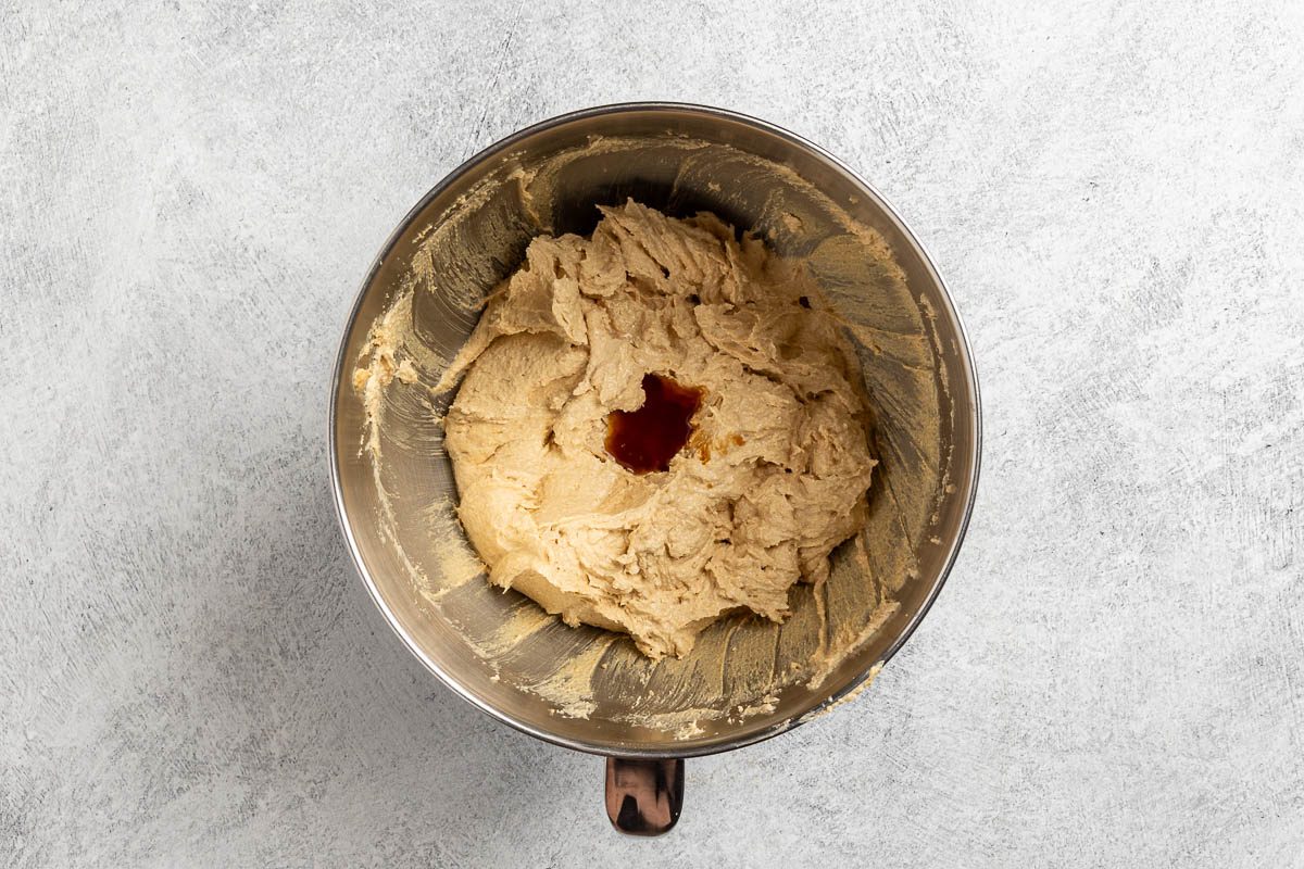 Taste of Home Chewy Peanut Butter Cookies recipe photo of adding the wet ingredients to the mixing bowl.