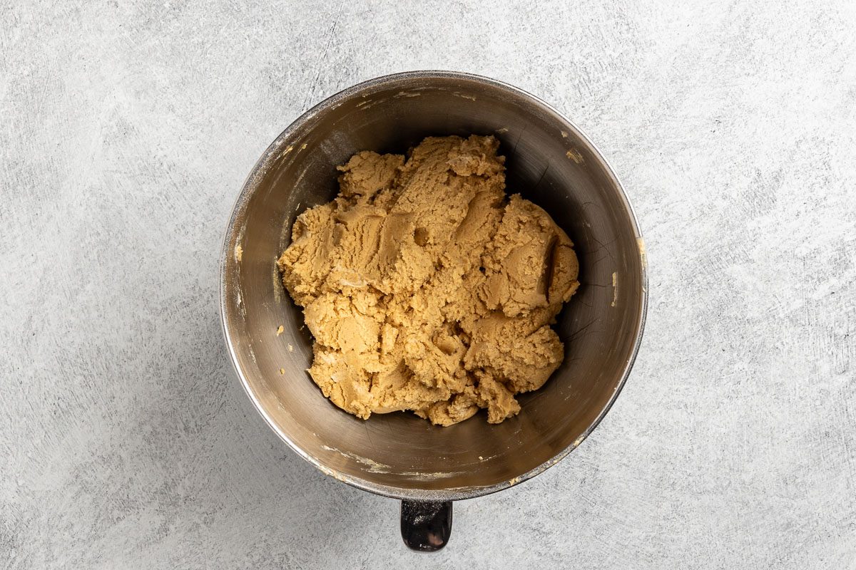 Taste of Home Chewy Peanut Butter Cookies recipe photo of adding the dry ingredients to the mixing bowl.