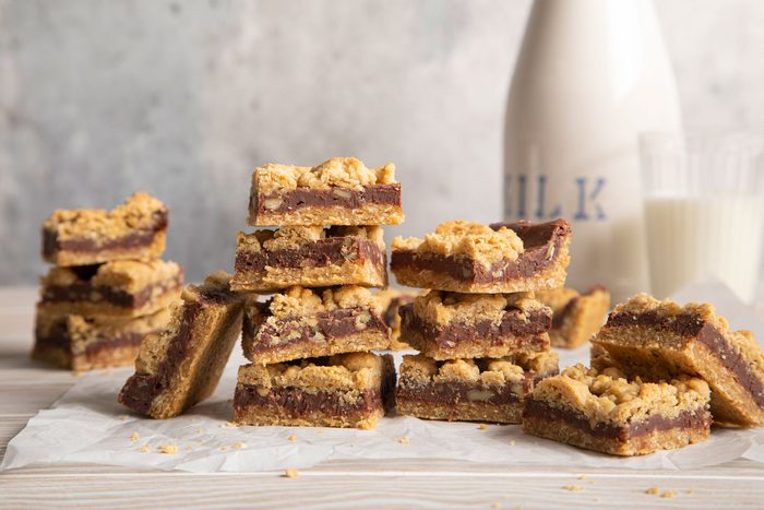 Chocolate Oatmeal Bars on a baking sheet served with milk