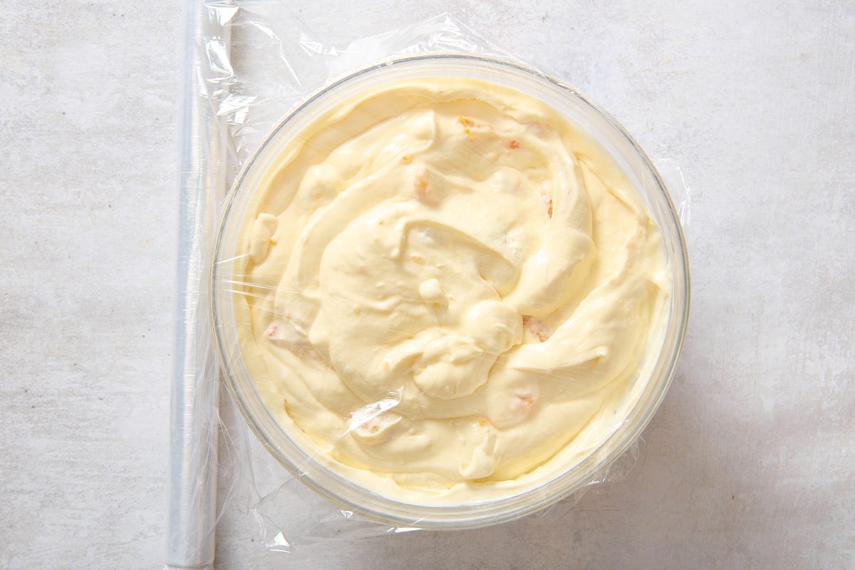 Covering the salad with plastic wrap