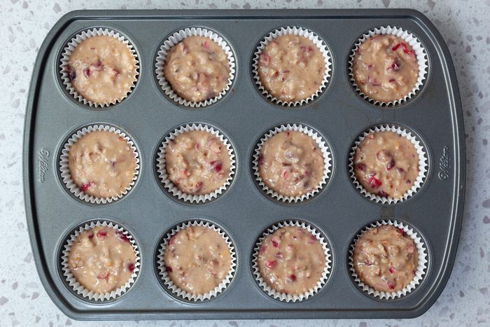 Step 5 of Taste of Home Cranberry Muffins is to bake the muffins