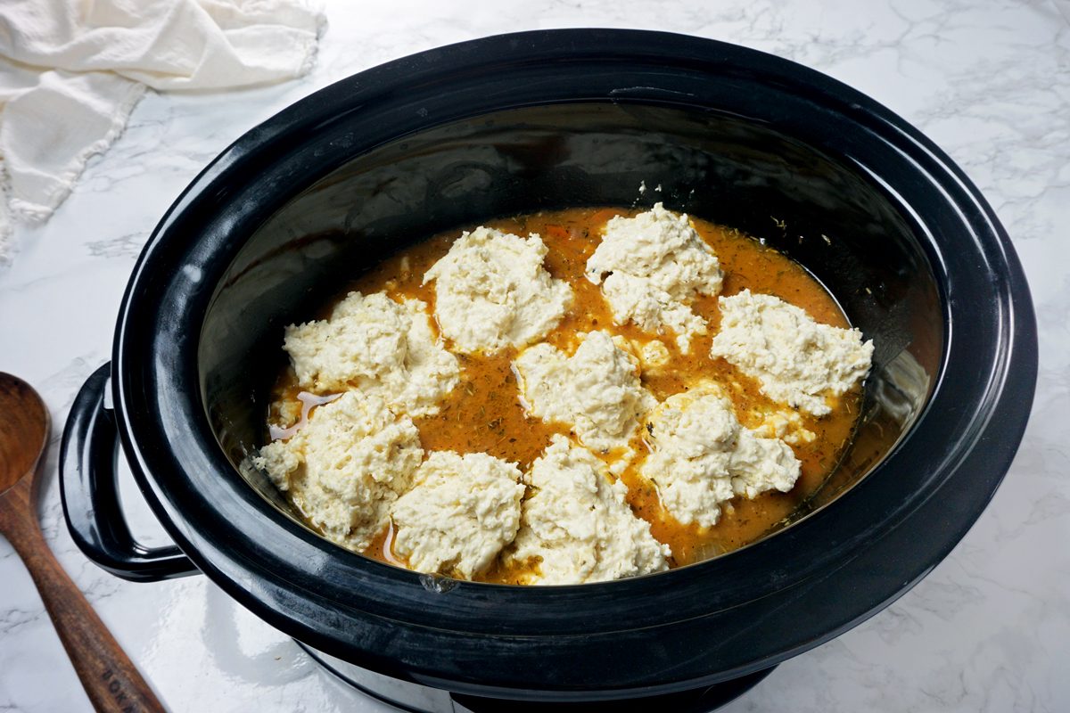 Dollops of dumpling dough in a slow cooker to make Crock-Pot Chicken and Dumplings RMS 201122 for Taste of Home