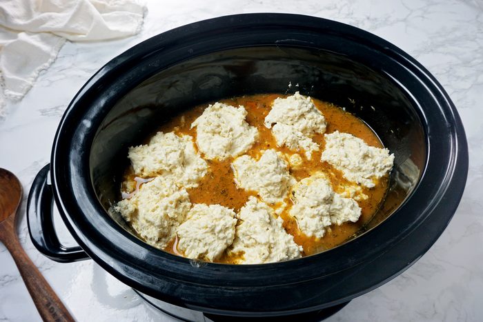 Dollops of dumpling dough in a slow cooker to make Crock-Pot Chicken and Dumplings RMS 201122 for Taste of Home