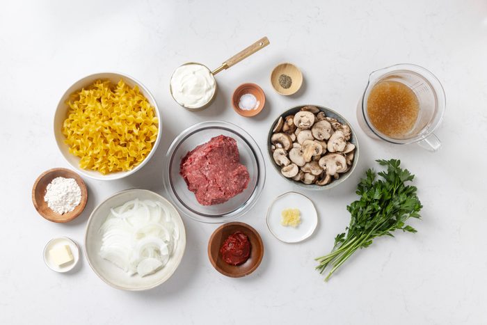 Ingredients for ground beef stroganoff on kitchen counter.