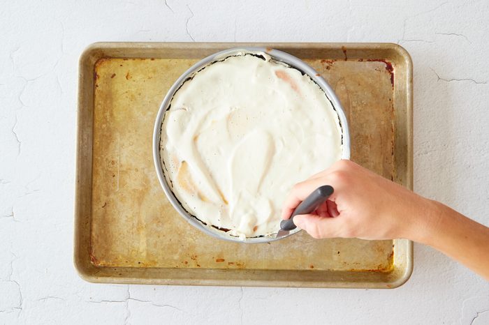 Use a knife to release the chocolate chip cheesecake from its pan.