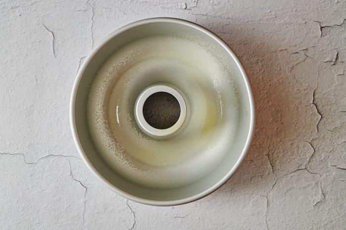 Prepare the tin for the plum pudding.