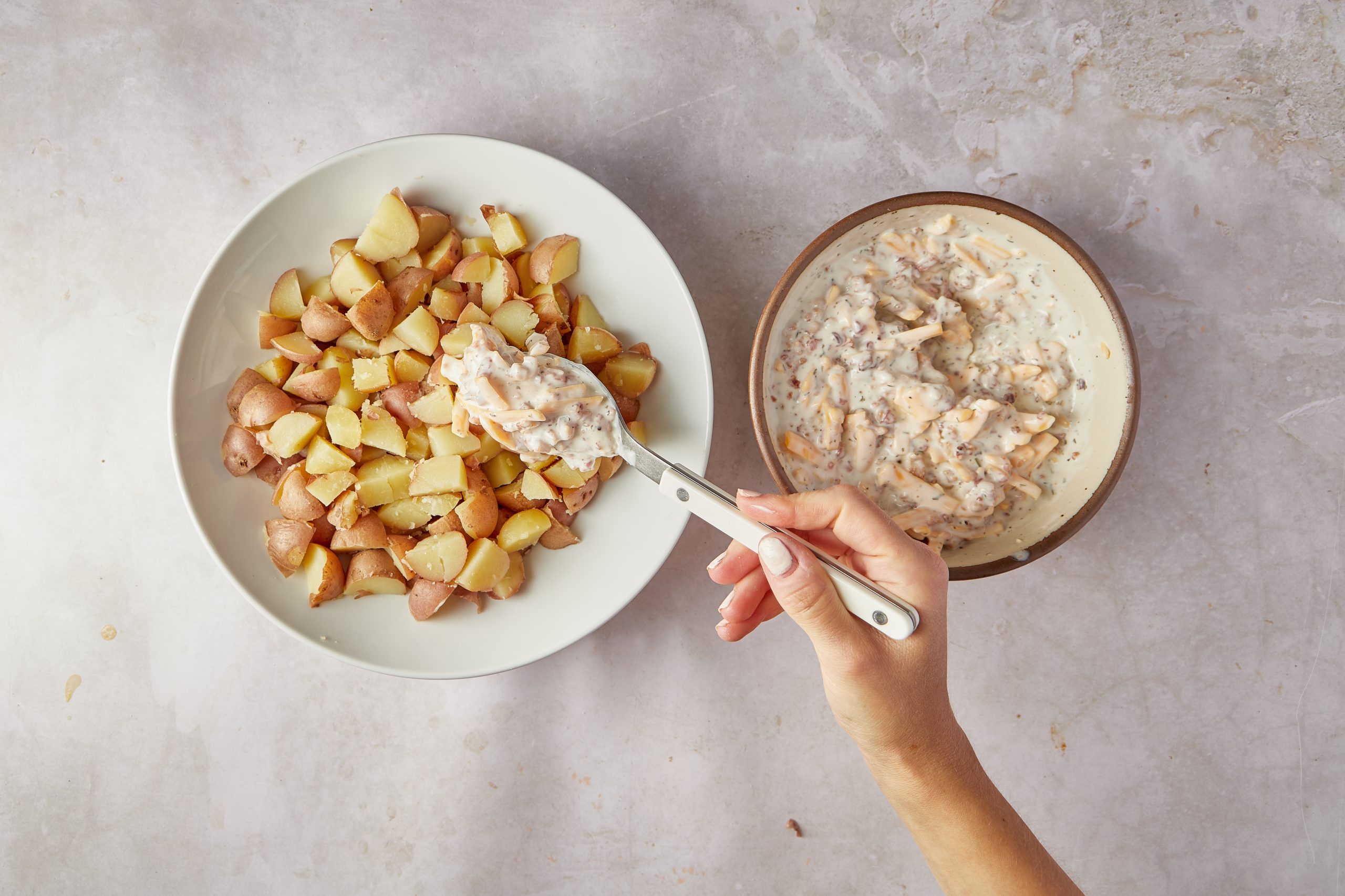 Mix the ingredients for ranch potato salad